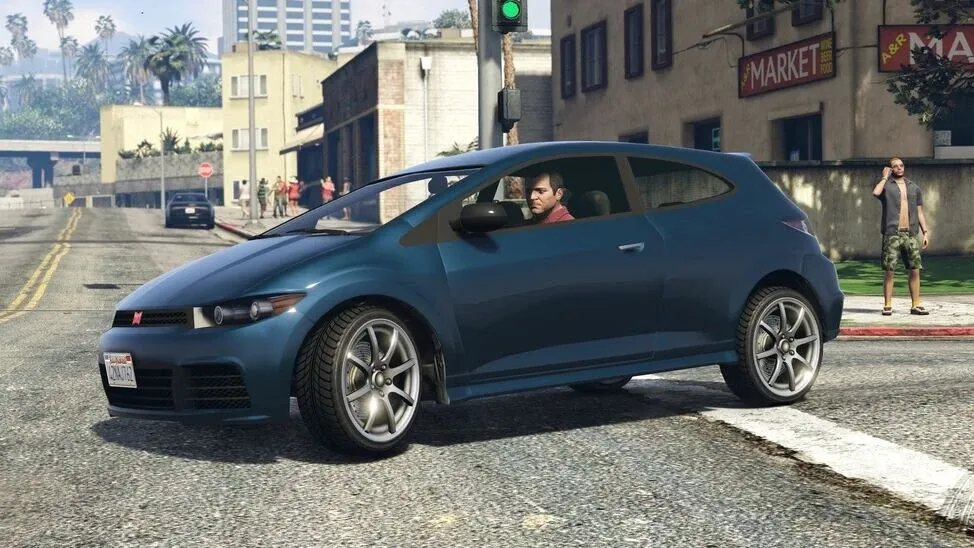 Un coche compacto azul parado en una calle de Los Santos
